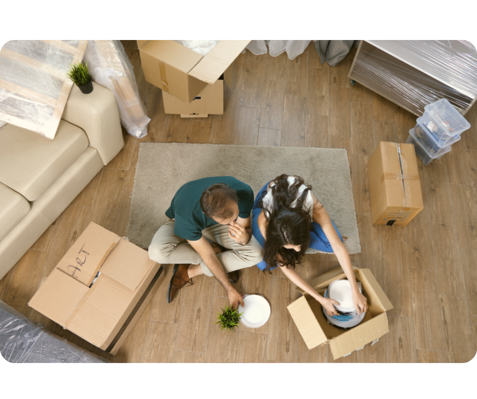 Couple opening moving box top view